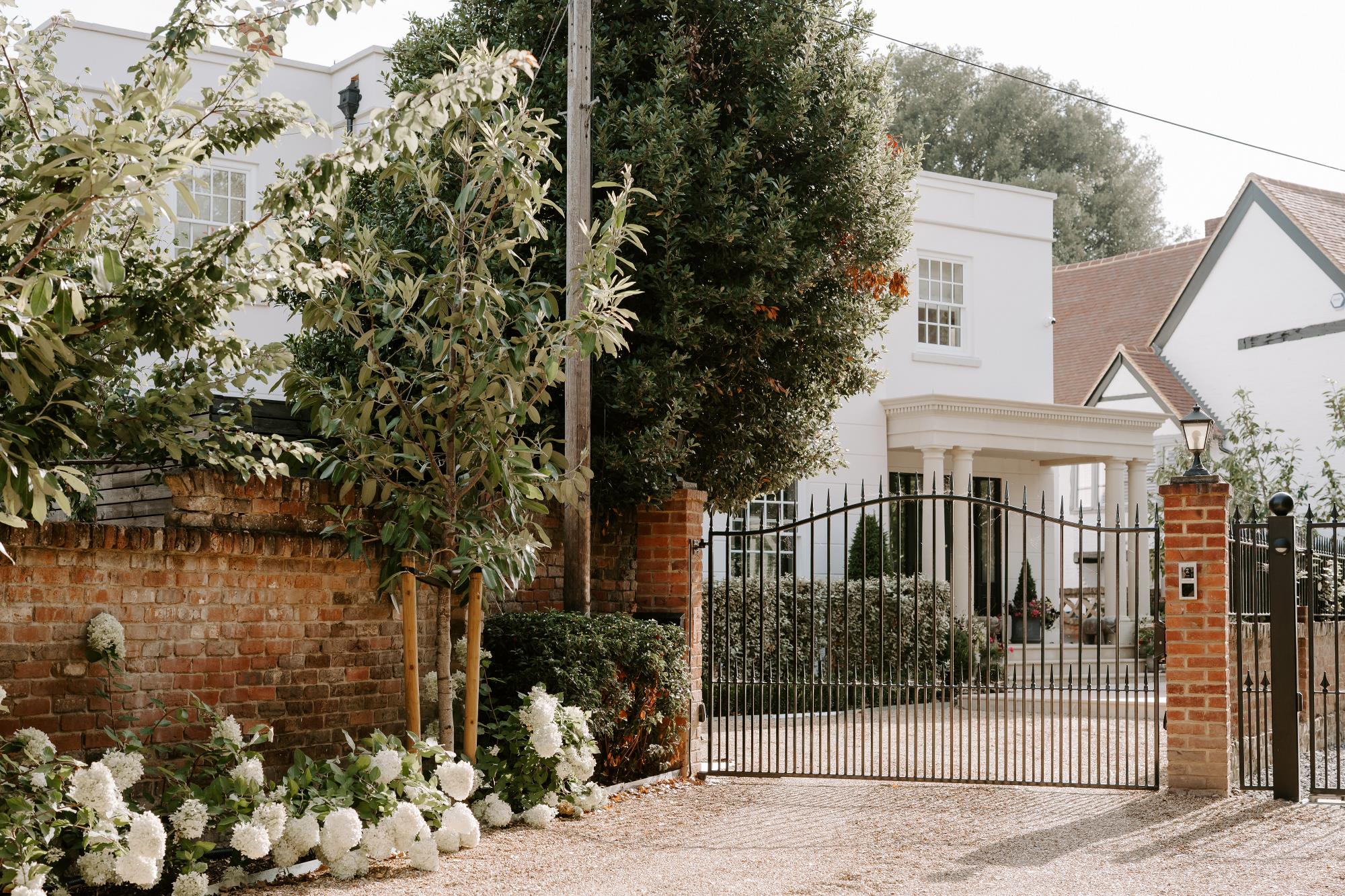 beautiful house with metal gates