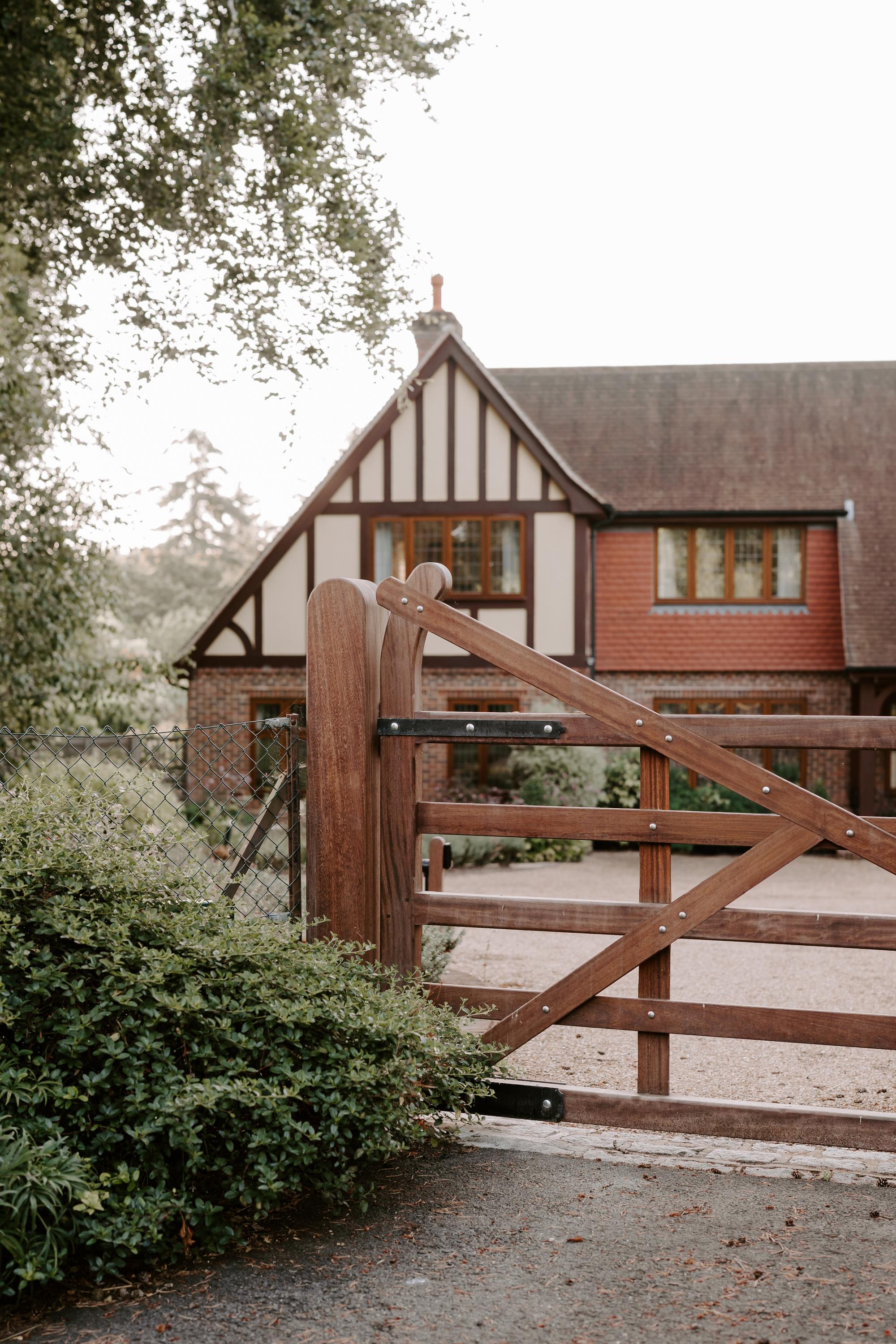 dark brown gate and house