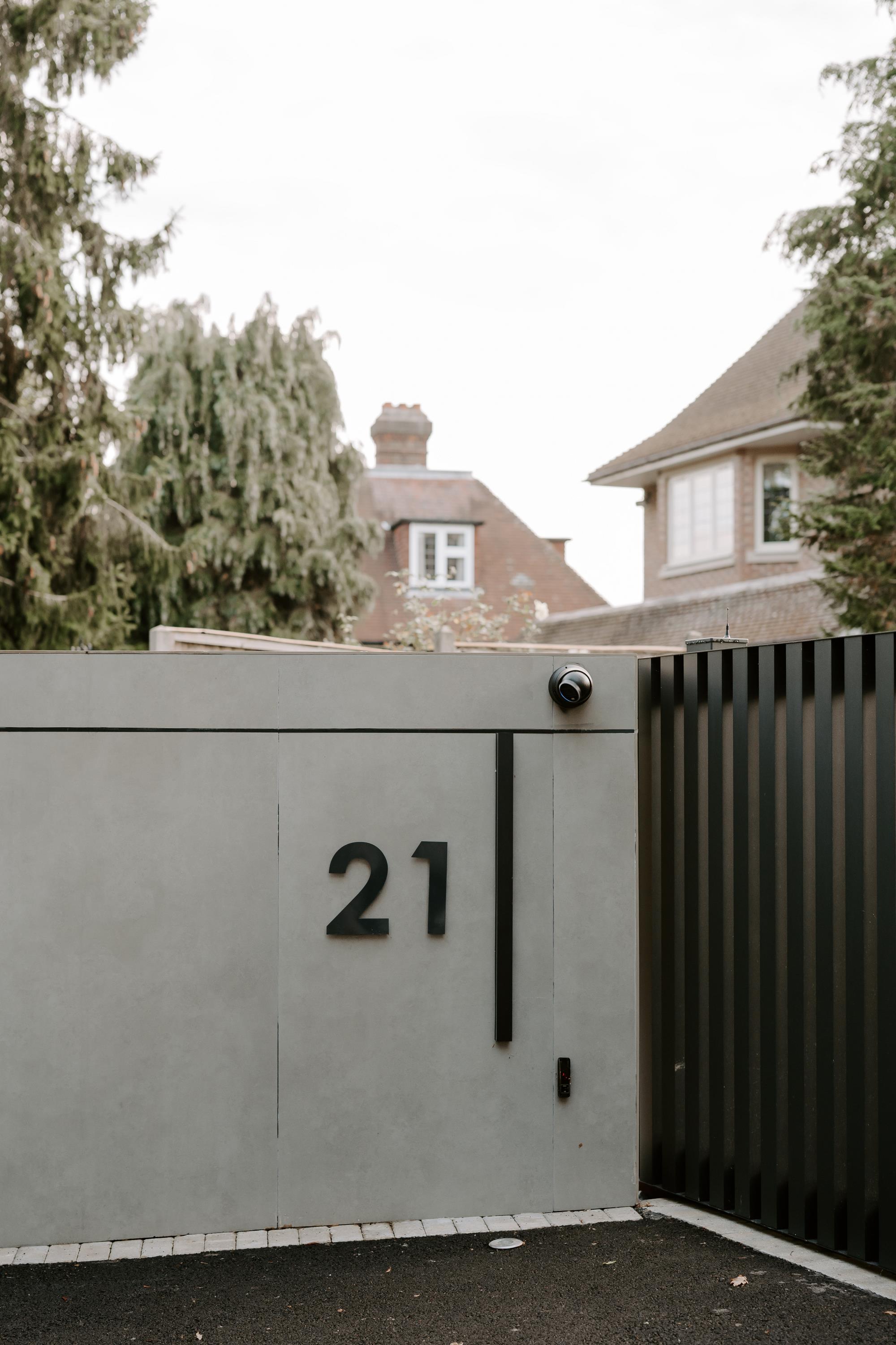 gates with number and camera